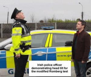 Police officer demonstrating the Romberg test by tilting head