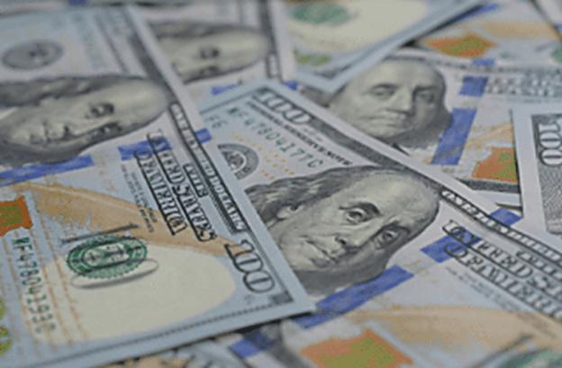 A series of $100 bills, symbolizing the price of a top-rated DUI defense lawyer in Georgia
